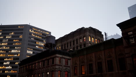 new york city: a contrast of old and new architecture at night