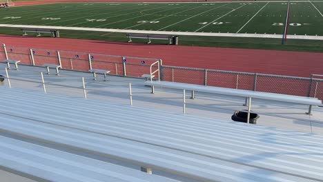 high school football field (track and field) at portola high school in irvine, california (usa). left to right bleacher seat pov
