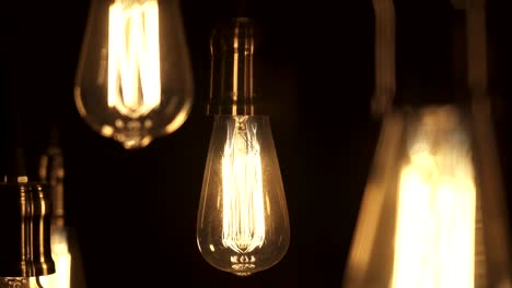 vintage style light bulbs hanging from the ceiling. old light bulb.