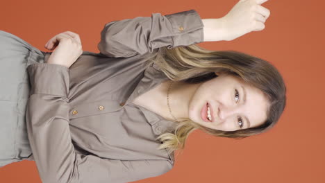 Vertical-video-of-Young-woman-showing-mind-to-camera.