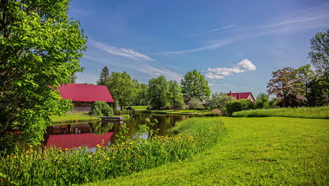 enchanting landscape with a river that flows between green grasslands and beautiful houses