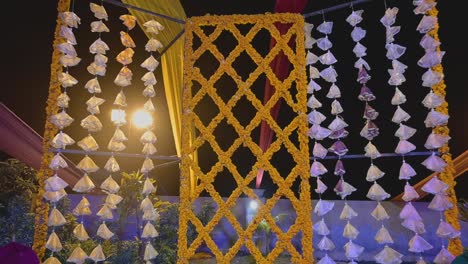 a lovely shot of marigold flower utilized as a backdrop in an asian wedding