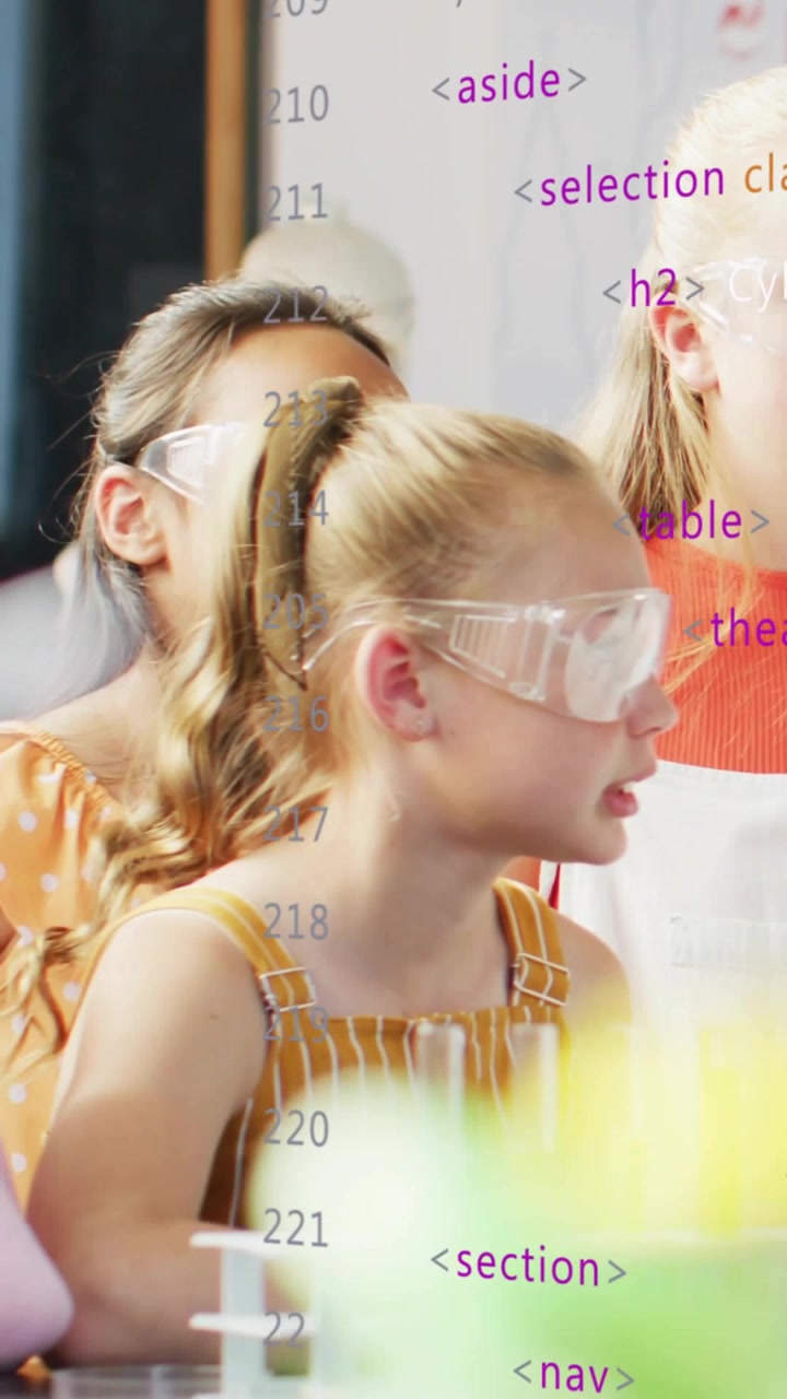 Vertical video: Girl watching off-screen STEM demo to learn while code overlay animating test tubes