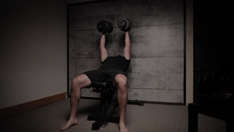 incline dumbbell chest fly, cinematic lighting, white man dressed in black gym attire