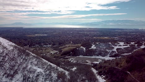 Flying-between-two-mountains-to-view-the-city-in-the-valley-below