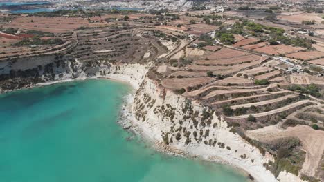 Aerial-drone-video-from-eastern-Malta,-Marsaxlokk-area,-Il-Hofra-l-Kbira-bay