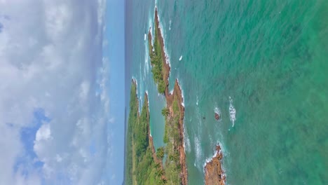 aerial backward over los coquitos rocky coast, cabrera in dominican republic