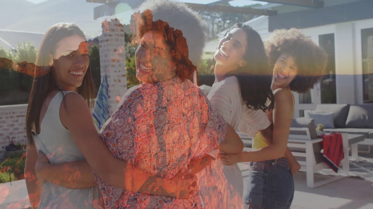 Hugging and smiling, four women outdoors with mountain landscape animation