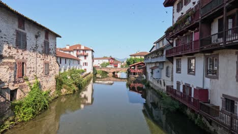 small river canal runs through picturesque saint john pied de port, fra
