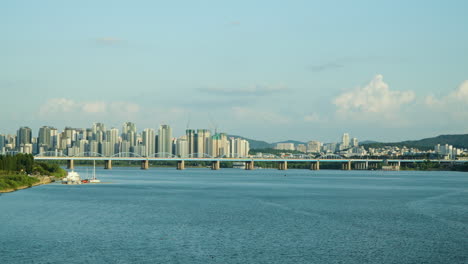 dongjakdaegyo or dongjak bridge over the han river and seoul city skyline, south korea