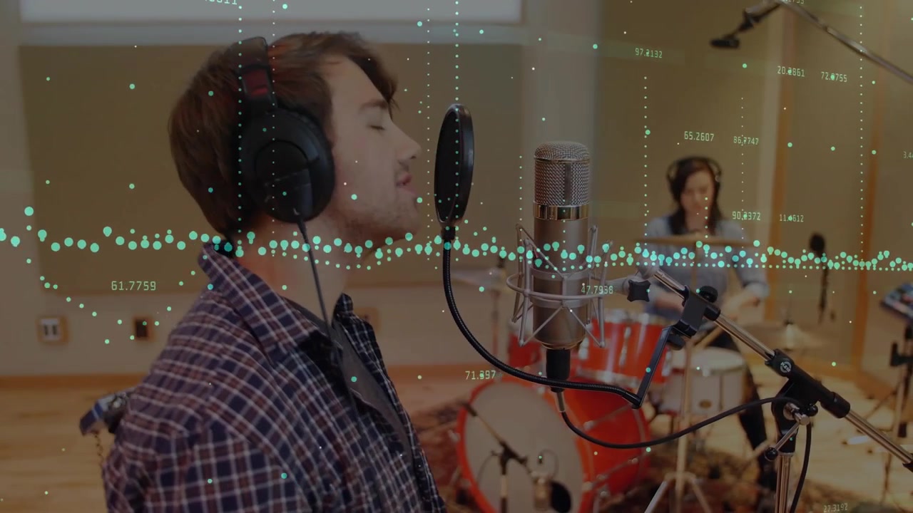 Male vocalist starting recording take by singing into mic, drummer keeping beat, waveform animating