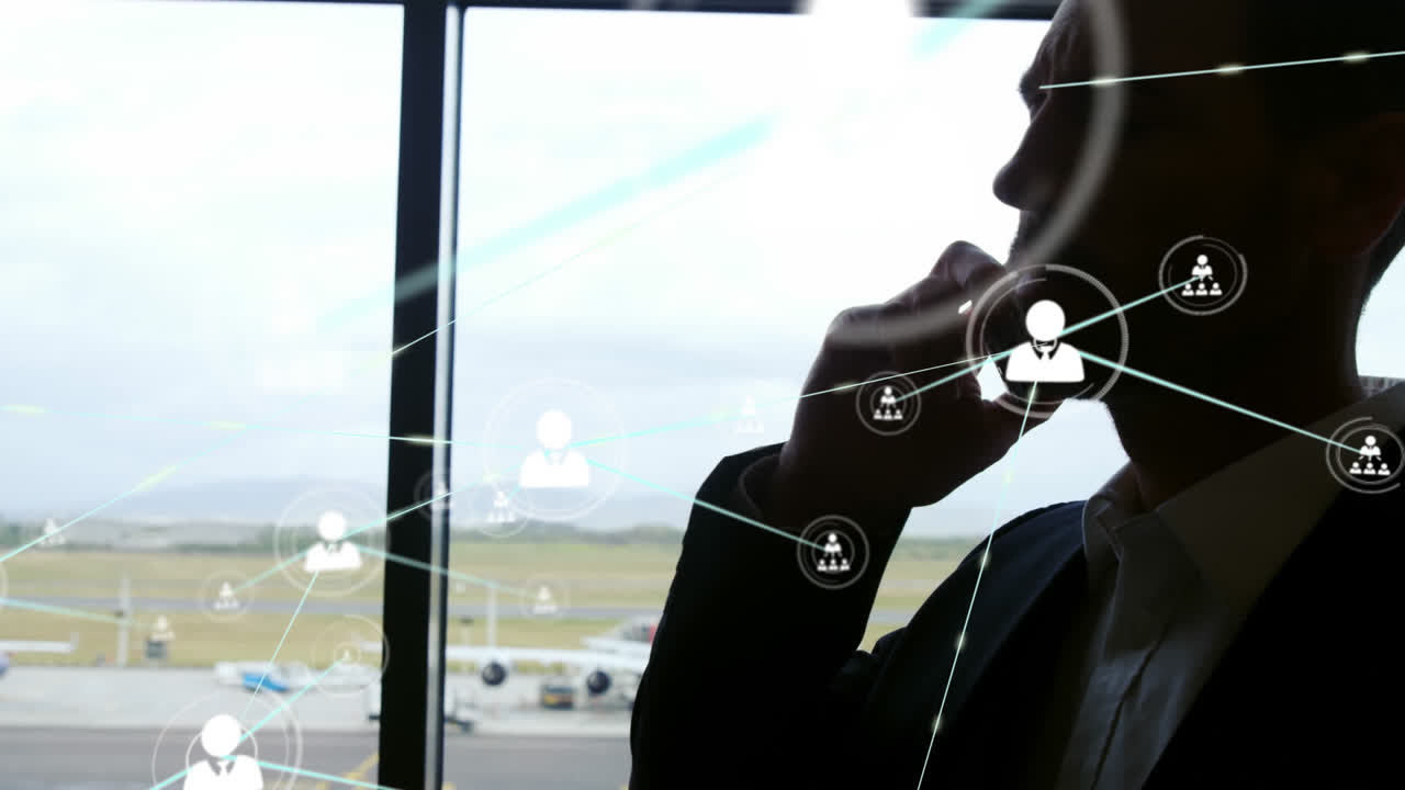 animación de una red de conexiones con iconos sobre un hombre de negocios caucásico hablando por teléfono inteligente