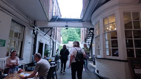 guests interact at hotel bar and reception