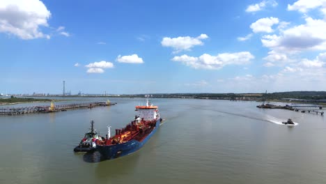 shipping, bulk carrier sailing up the thames river, london