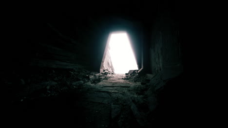 light pours through a narrow opening above crumbling stone steps