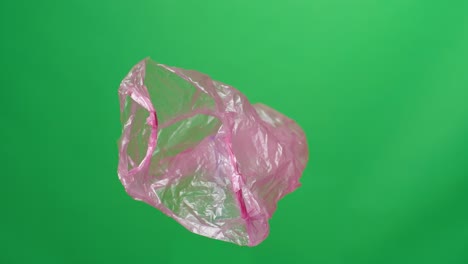 red plastic bag on green screen background