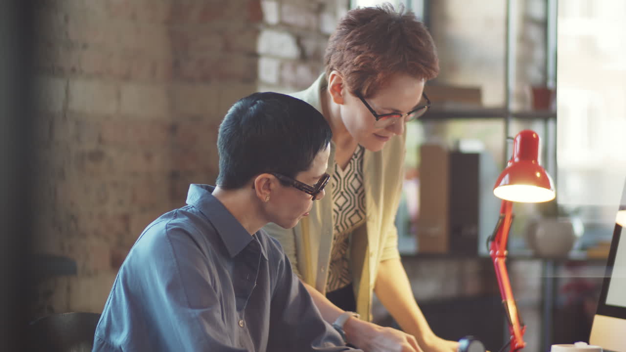 Two Women Collaborating at a Desk
