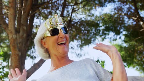 senior woman wearing party props