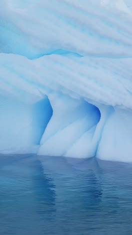 Blue-Iceberg-Ice-Formation-Close-Up-Detail-in-Antarctica,-Vertical-Nature-Video-for-Social-Media,-Instagram-Reels-and-Tiktok-of-Sea-Icebergs-Amazing-Beautiful-Patterns-in-Antarctic-Peninsula-Ocean