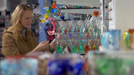 young woman showing interest to venetian glass