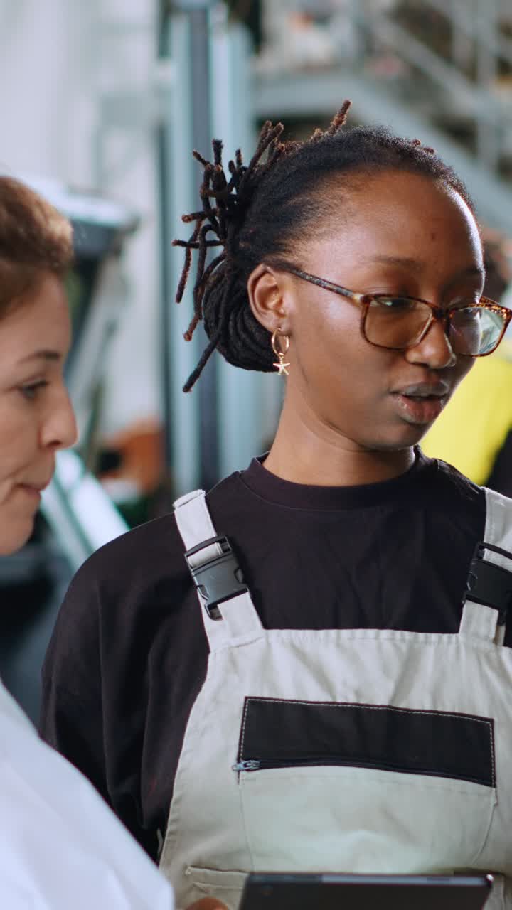 Vertical video Mechanic woman calculates car fix