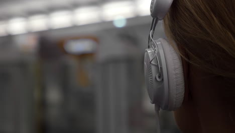 girl listening to music in metro