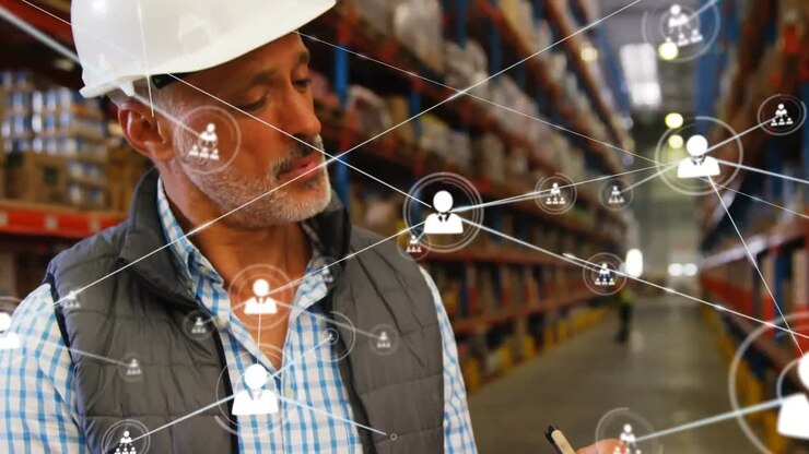Animation of network of profiles over caucasian male supervisor writing on clipboard at warehouse
