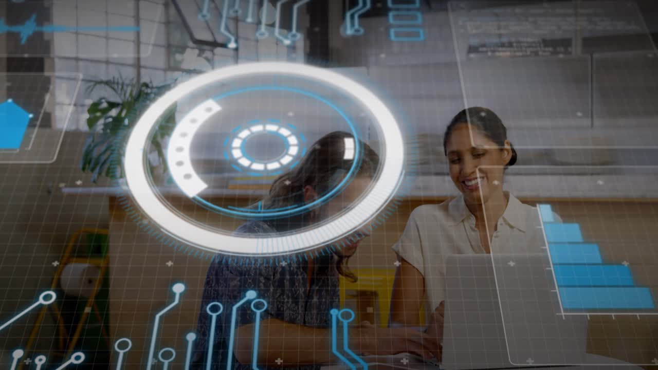 Two colleagues leaning at laptop in lounge HUD appearing and overlaying data for tech collaboration