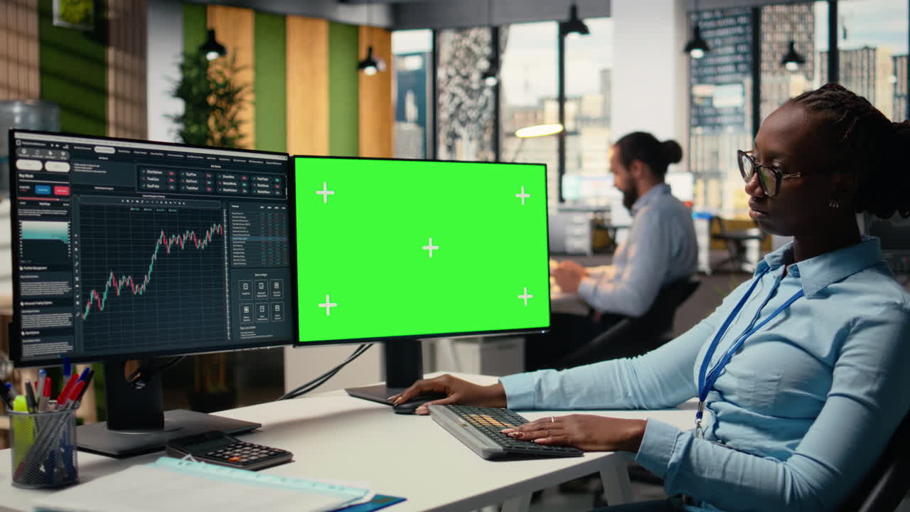 Portfolio manager analyzes stock market trends on green screen PC