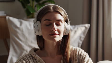 woman relaxing with headphones at home