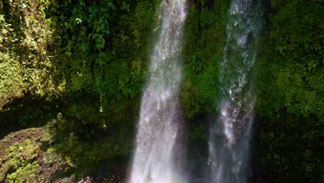 panning up revealing togonan falls near mainit in tropical jungle in the philippines