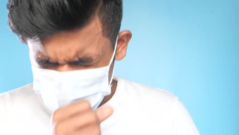 man coughing with mask