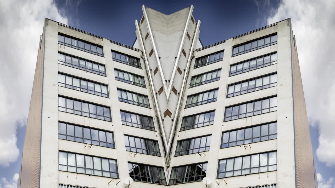 Old factory and industrial complex with passing clouds made into abstract pattern