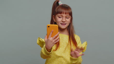 Child-girl-kid-blogger-taking-selfie-on-smartphone-communicating-video-call-online-with-subscribers