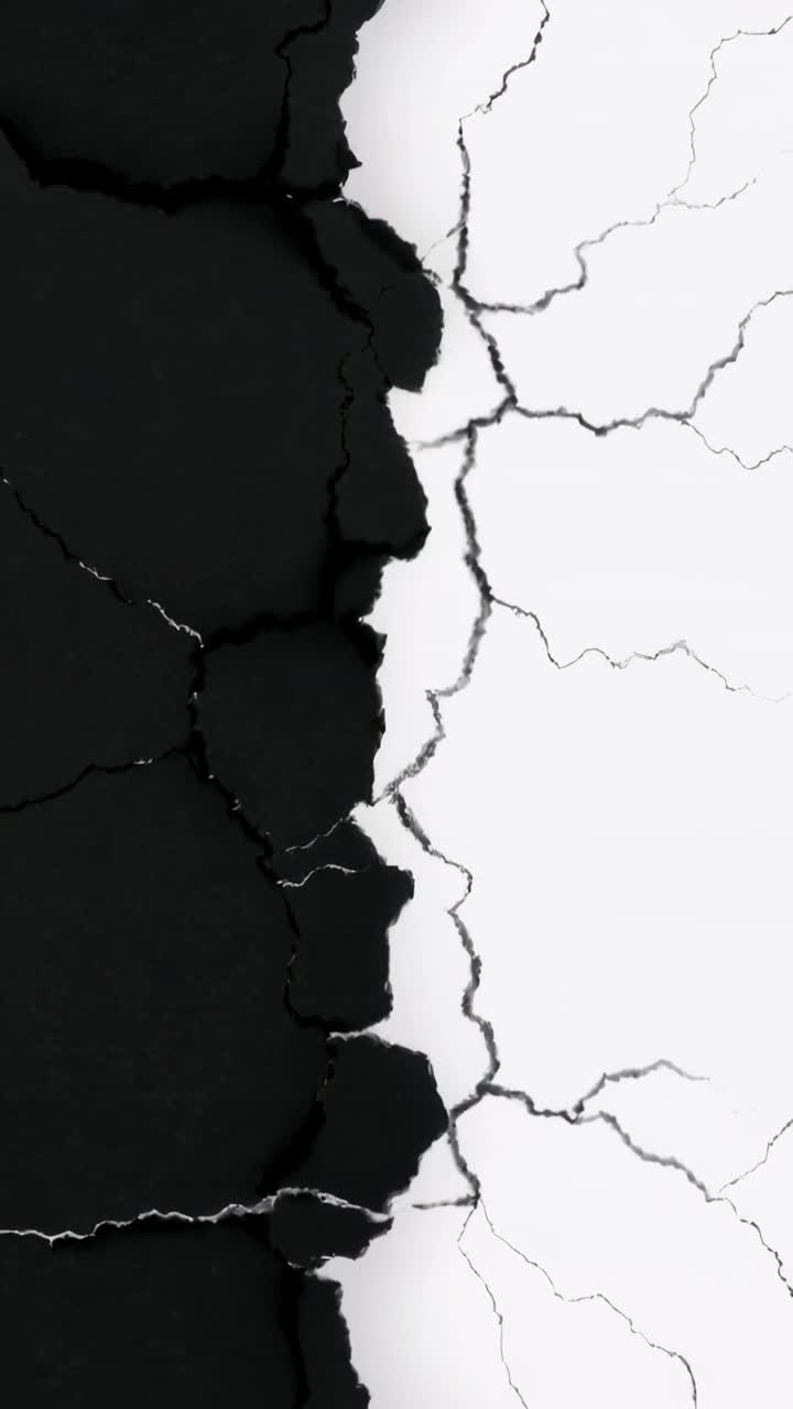 Vertical video: Shifting jagged seam under light shifts in closeup, showing ruffled edge and cracks
