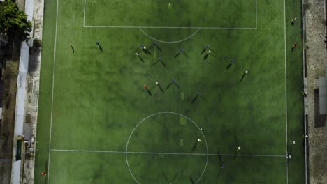 amateur soccer players train in a friendly game during the night