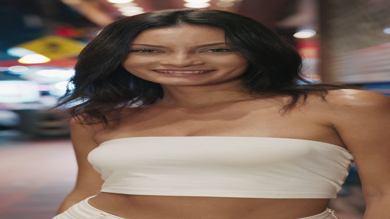 Smiling Woman in City at Night