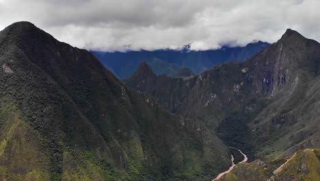 aerial view of sacred valley with incan citadel machu picchu in the distance, hd