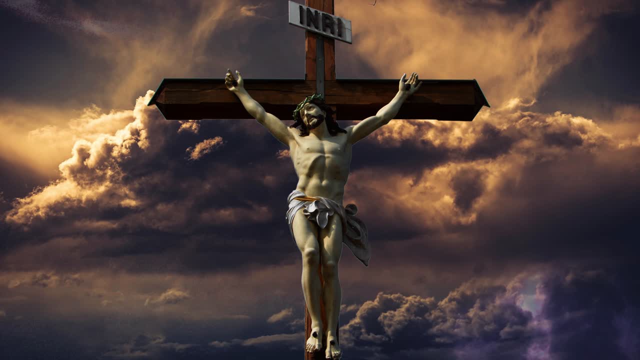 wooden statue of Jesus with a dark cloud background and a thunderstorm