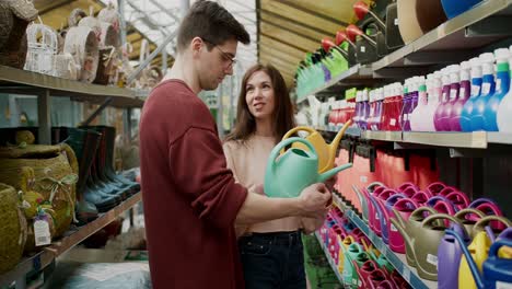 choosing the right garden watering can: couple's indecision at the store