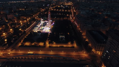 Flying-over-amusement-park-in-night-Valencia-Spain