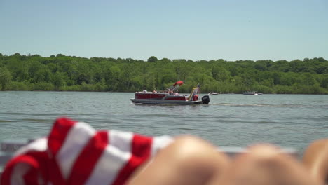 pontoon boat cruising on a lake