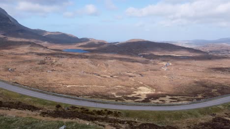 Clouds-rolling-over-mountainous-landscape-of-Quinag-Sail-Gharbh-in-the-remote-outdoor-wilderness,-Assynt-district-of-Sutherland,-highlands-of-Scotland-UK