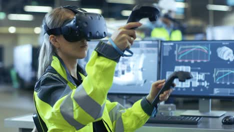 female industrial engineer wearing virtual reality headset and holding controllers, she uses vr technology for industrial design, development and prototyping in cad software.