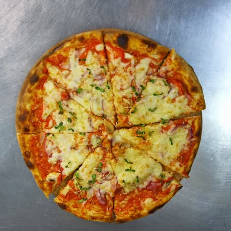 hands are taking pizza portions. ready pizza on the table. people take slices of delicious pizza in pizzeria. top view