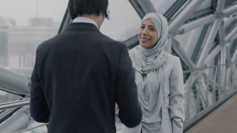 businesswomen meeting on a city bridge