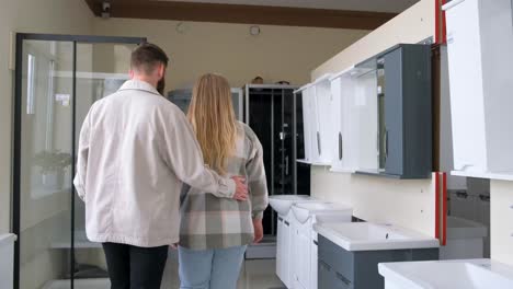 customers browsing bathroom products in a showroom