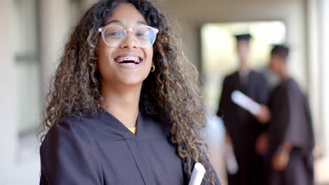 Teenage-biracial-girl-celebrates-graduation