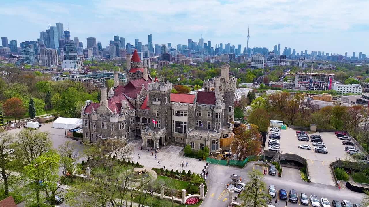 aerial tracking left around Casa Loma and CN Tower in Toronto