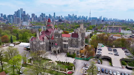 aerial tracking left around casa loma and cn tower in toronto